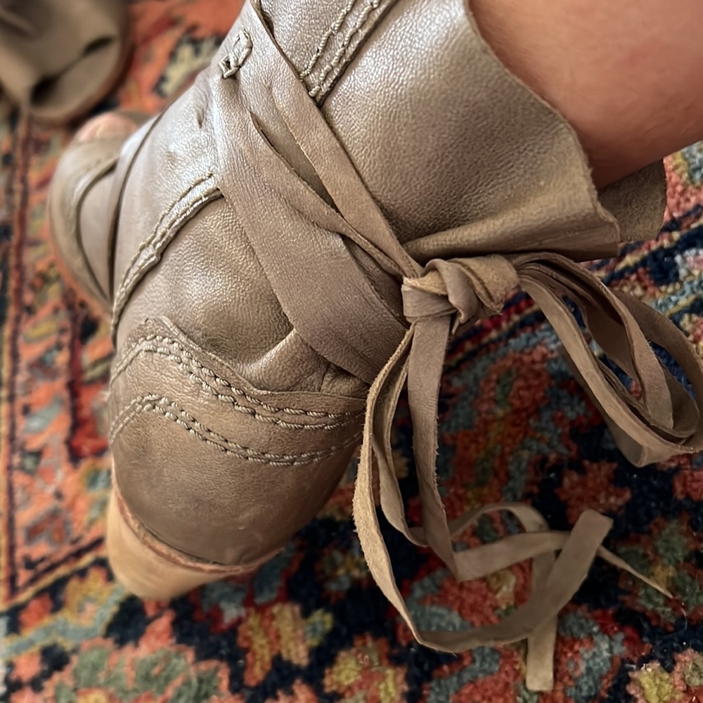 Gorgeous leather peep toe tie up booties.